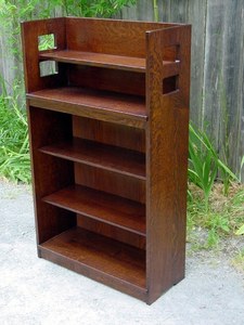 Replica Charles Limbert open bookcase with square cut out design.